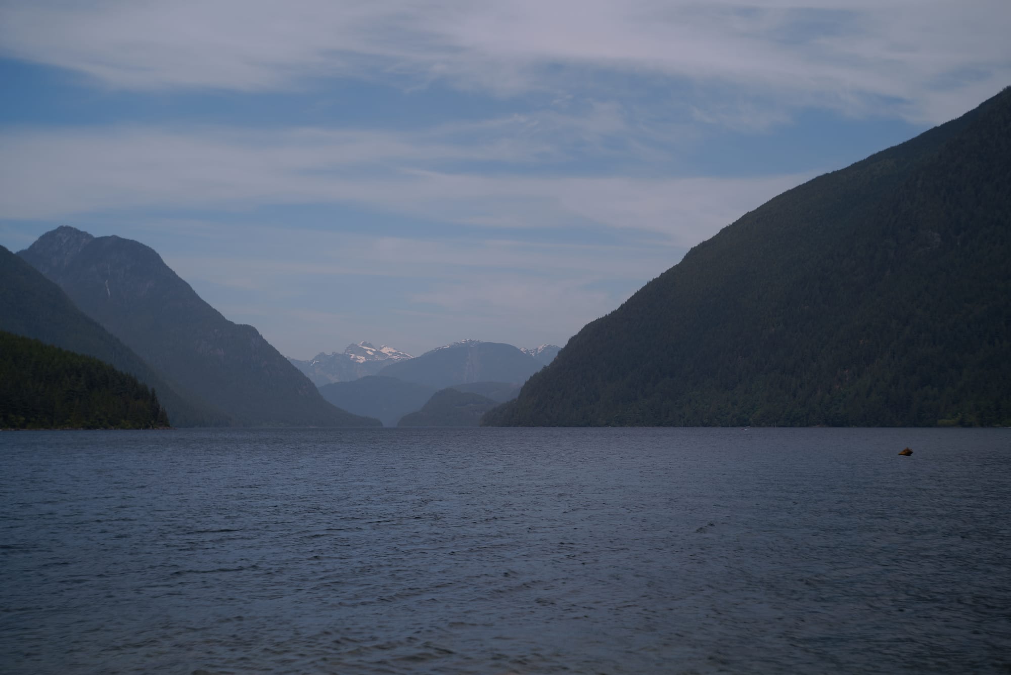 A photograph of a lake surrounded by mountains